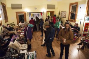 A craft fair takes place in the community room. 